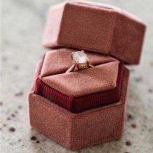 Moissanite and rose gold ring in solitaire setting